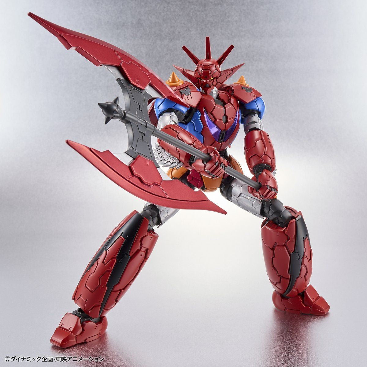 Shin Getter Robo action figure in red, blue, and silver, wielding a massive double-bladed battle axe.