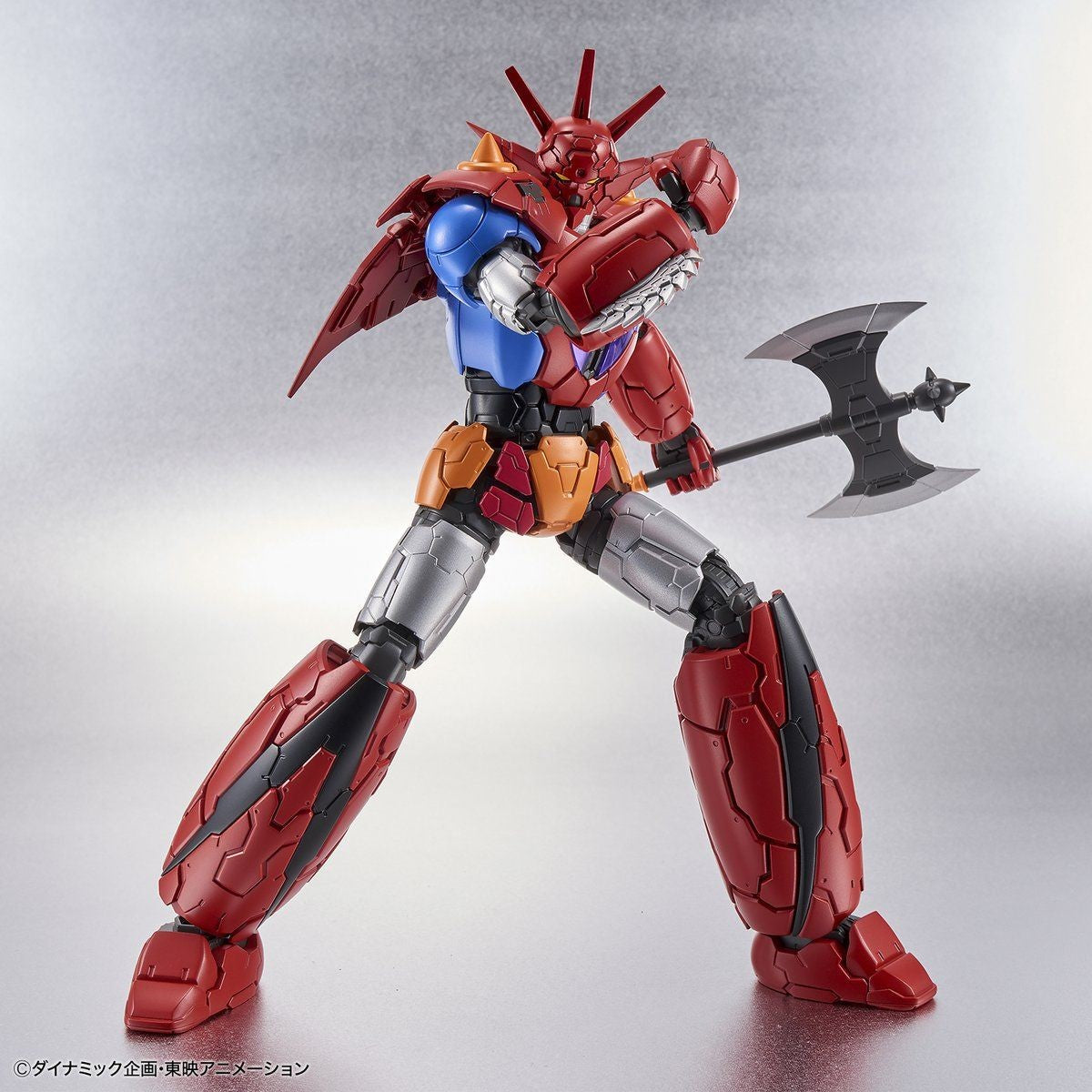 Shin Getter Robo action figure in red, blue, and silver, holding a large battle axe in a dynamic combat pose.