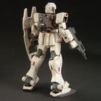Off-white Gundam model kit viewed from behind, featuring a backpack, shield, and rifle on a black background.