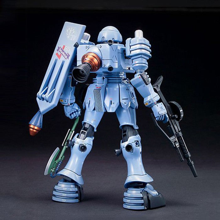 Model kit Bandai EMS-10 Zudah HGUC 1:144, vista posteriore del robot con fucile e scudo su sfondo nero.