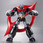 Mazinger Zero action figure: a black and silver robot with a menacing face, red chest plate, and large red wing accessory.