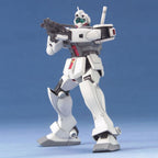 White Gundam model kit action figure holding a rifle against a plain blue background.
