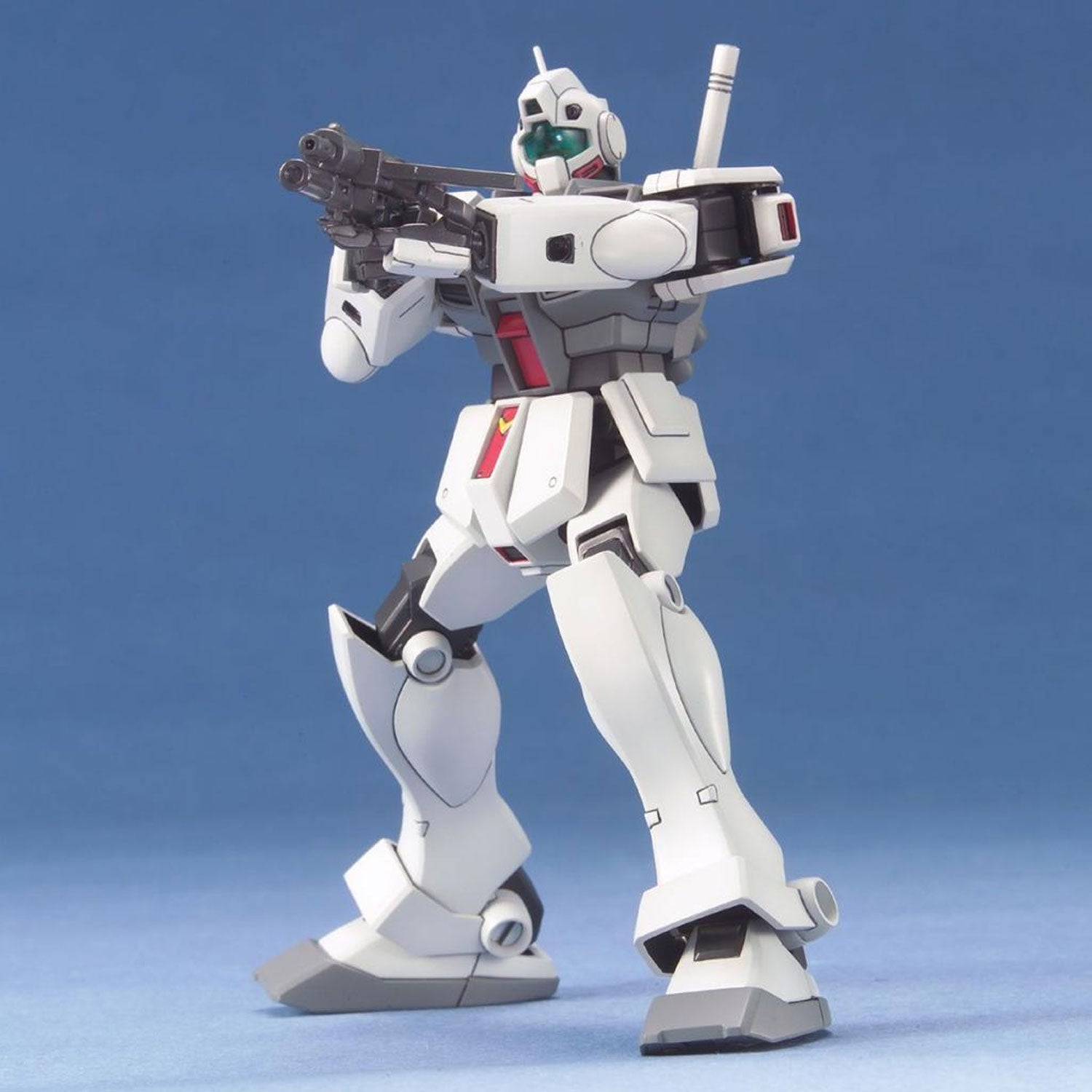White Gundam model kit action figure holding a rifle against a plain blue background.