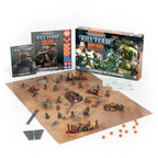 Warhammer 40,000 Kill Team starter set with miniatures, terrain, rulebooks, game board, and dice on a white background.