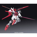 Model kit Bandai RG 1/144 Aile Strike Gundam: vista posteriore in posa dinamica con spada laser su sfondo nero.