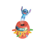 Stitch Pop-Up game with a blue Stitch figure jumping out of a red barrel decorated with tropical graphics and colorful slots.