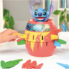 Stitch Pop-Up game with a red barrel, colorful plastic swords, and a blue Stitch figure on top.
