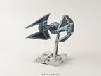 Model kit of a Star Wars TIE Interceptor in light gray, mounted on a detailed display stand against a neutral background.