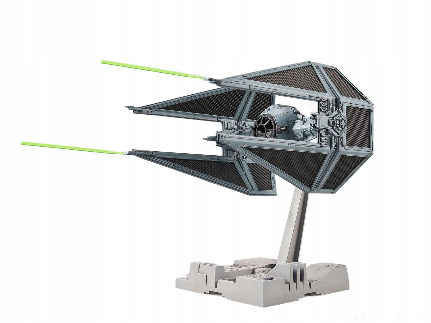 Grey Star Wars TIE Interceptor model with firing green laser beams on a display stand, isolated on white.