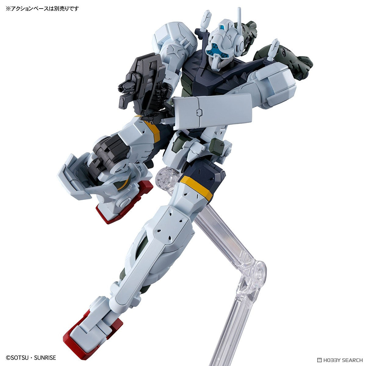 Model kit Bandai 1/144 HG Gelgoog GQ Bocata's in posa dinamica con fucile, su base espositiva.